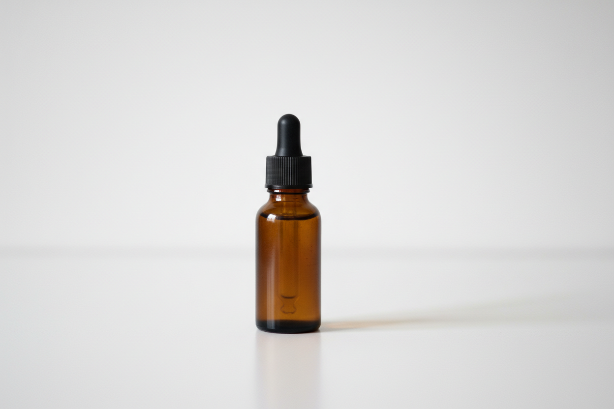 1 brown small miniture hair oil brown glass bottle